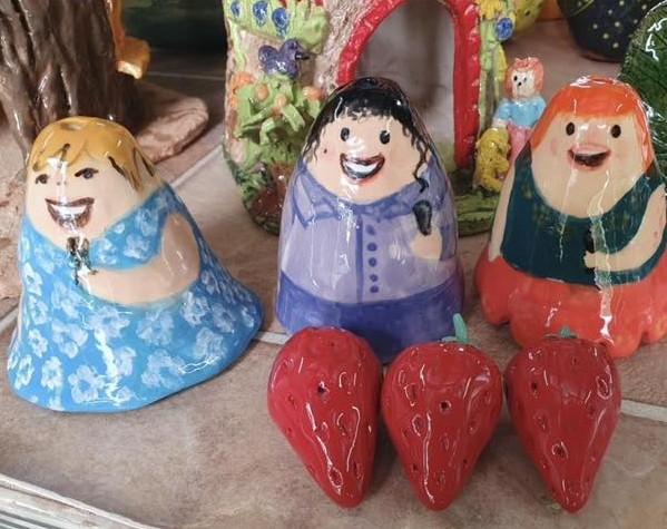 Cute character figurines with strawberries